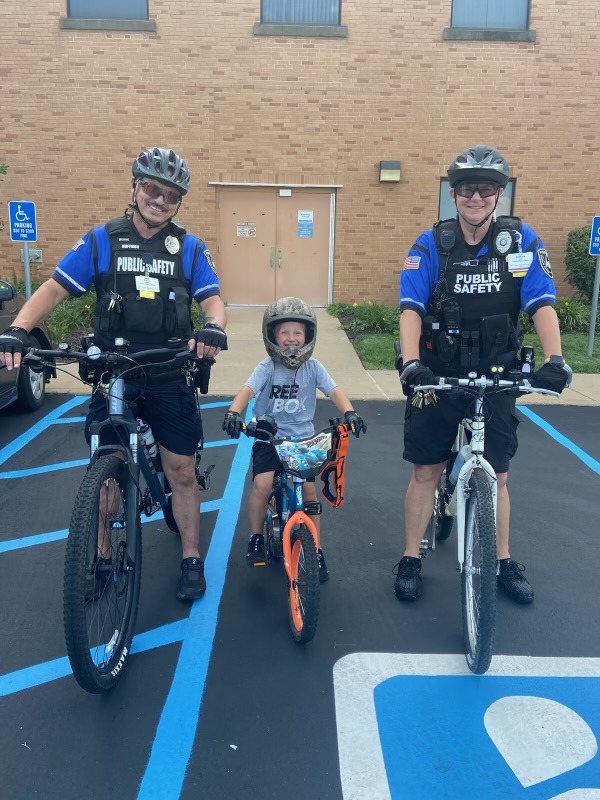 MoBap Bike Patrol Officers Paul Huffmon and Sonya Diehl with honorary bike officer